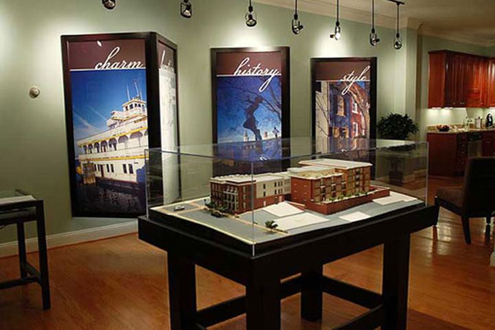 Signage project: new condominium sales office with custom displays and model table
